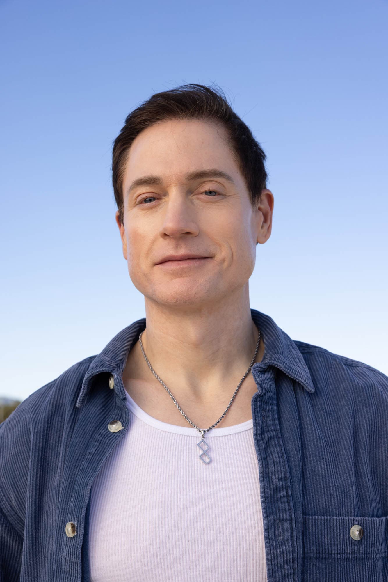Bryan Johnson outdoors in a blue overshirt in 2026