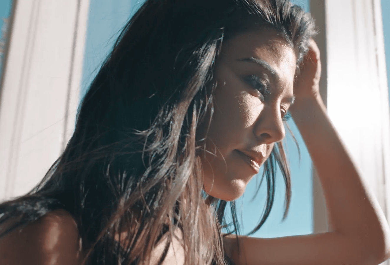 Kourtney Kardashian in a sunlit portrait from a GQ photoshoot