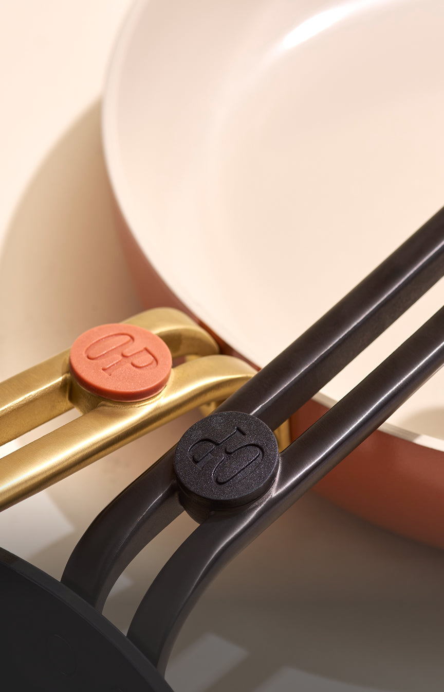 Close-up of Our Place Essentials ceramic nonstick fry pan in Terracotta with cast stainless steel handle