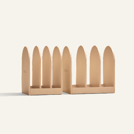 Our Place Essentials storage rack holding ceramic nonstick fry pans upright